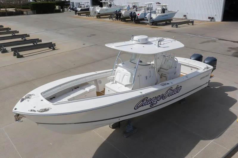 Slide: The Image of 2018 Regulator 31 boat on display in a marina setting. - 7