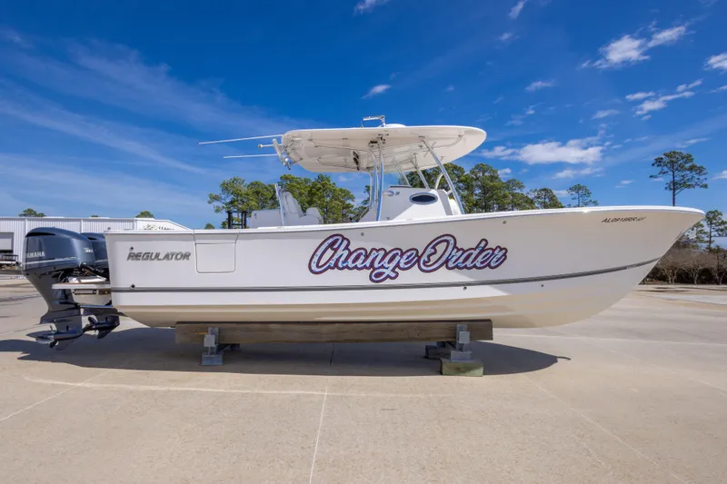 Slide: The Image of 2018 Regulator 31 boat named "Change Order" on display with Yamaha engines. - 8