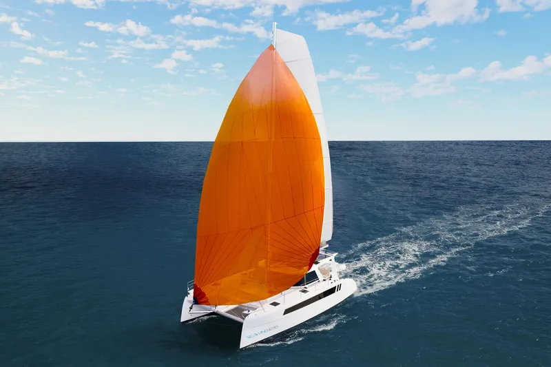 Slide: The Image of 2026 Seawind 1270 catamaran sailing with vibrant orange sail on open ocean. - 16