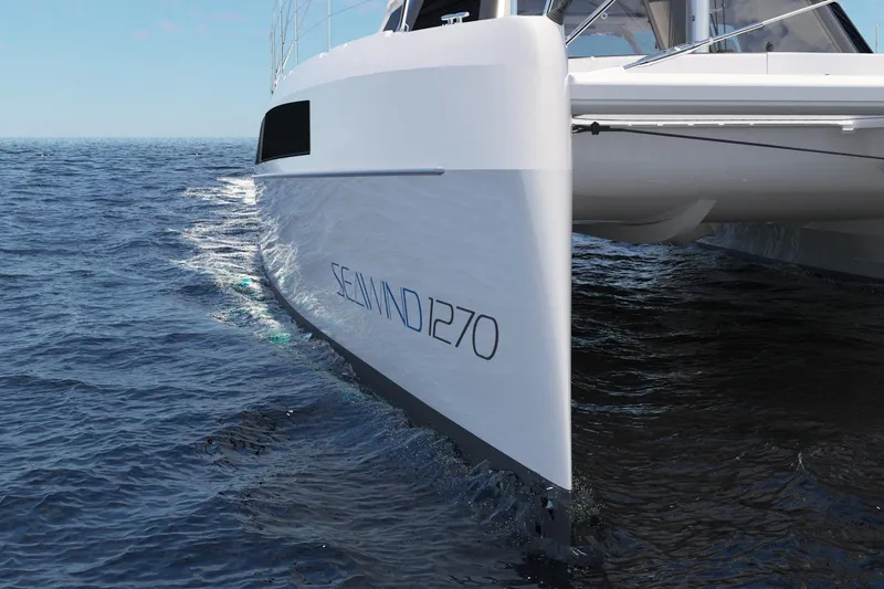 Slide: The Image of 2026 Seawind 1270 catamaran sailing on open ocean waters. - 19