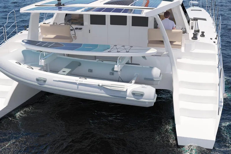 Slide: The Image of 2026 Seawind 1270 catamaran with solar panels and dinghy on ocean. - 7