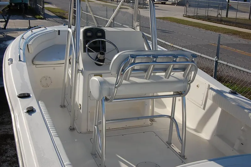 Slide: The Image of 2005 Sea Hunt Triton 220 boat interior with steering console and seating. - 10