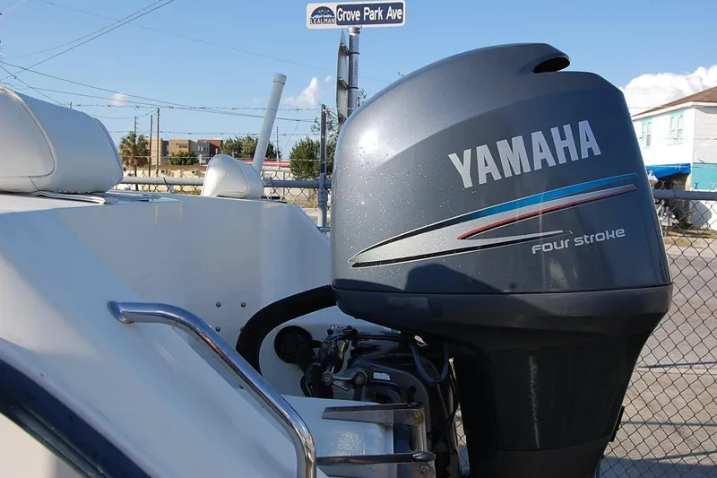 Slide: The Image of 2005 Sea Hunt Triton 220 boat with Yamaha four-stroke outboard motor at Grove Park Ave. - 5