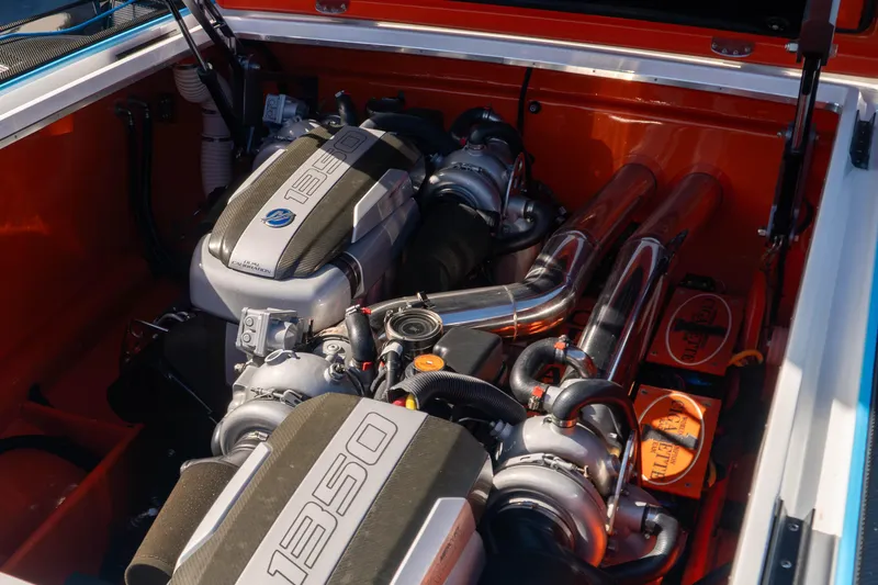 Slide: The Image of 2022 Cigarette 515 engine compartment with dual 1350 horsepower engines, showcasing performance and power. - 6