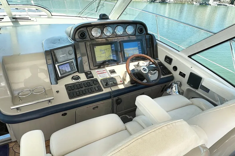 Slide: The Image of 2008 Sea Ray 48 Sundancer helm with navigation system. - 14