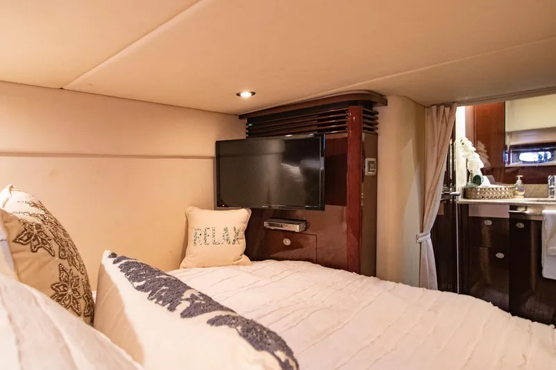 Slide: The Image of Luxurious cabin of 2008 Sea Ray 48 Sundancer with TV and bed. - 24