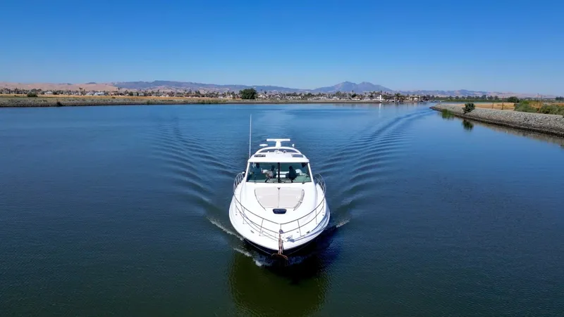 Slide: The Image of 2008 Sea Ray 48 Sundancer cruising on calm waters. - 4