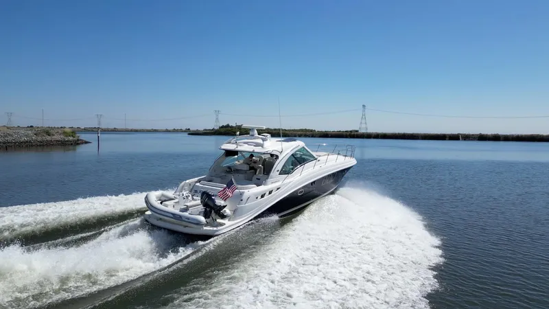 Slide: The Image of 2008 Sea Ray 48 Sundancer cruising on calm waters. - 5