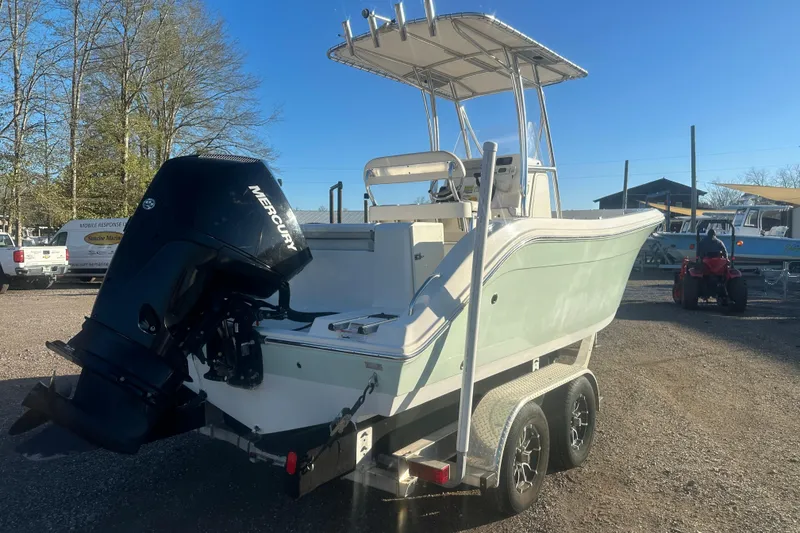 Slide: The Image of 2021 Cobia 220 Center Console boat on trailer with Mercury outboard engine. - 3