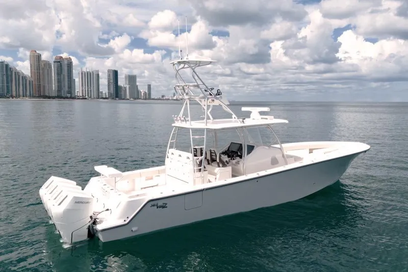 Slide: The Image of 2026 SeaVee 420Z boat on calm water with city skyline in background. - 4