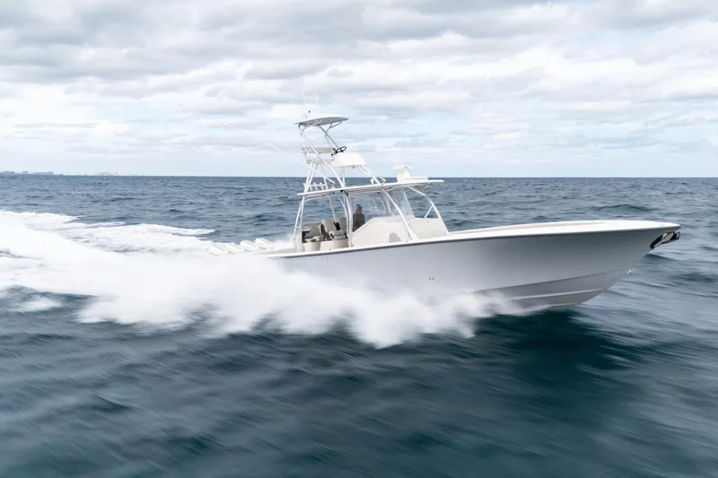 Slide: The Image of 2026 SeaVee 420Z boat speeding on open ocean under cloudy sky. - 5