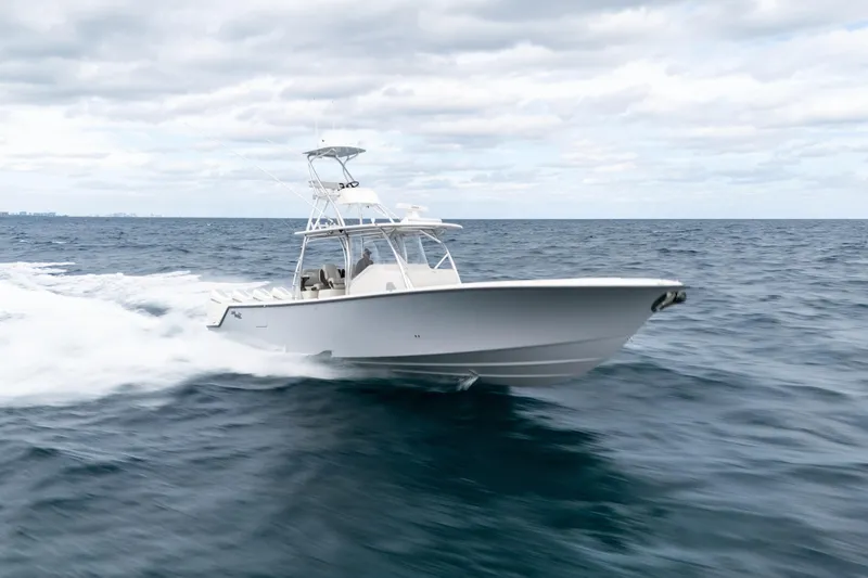 Slide: The Image of 2026 SeaVee 420Z boat cruising on open ocean under cloudy sky. - 6