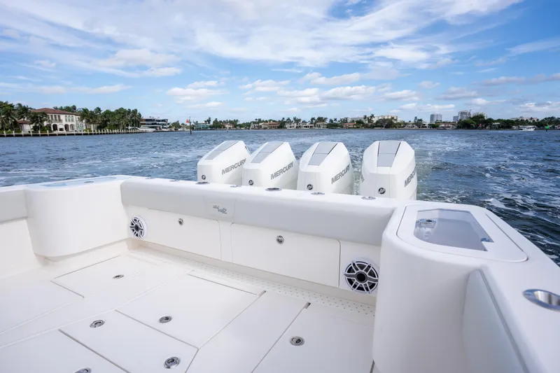 Slide: The Image of 2026 SeaVee 420Z boat with Mercury engines on a scenic waterway. - 7