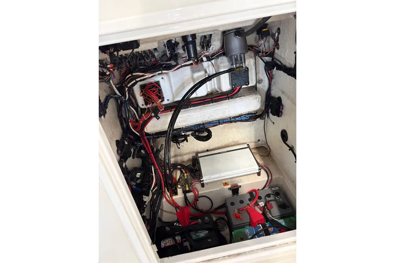 Slide: The Image of 2020 Triton 22 LTS boat wiring and battery compartment, showcasing electrical components and connections. - 4
