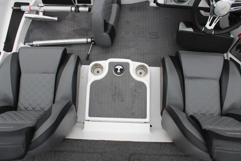 Slide: The Image of 2021 Caymas CX 18 SS boat interior with gray seating and cup holders. - 10