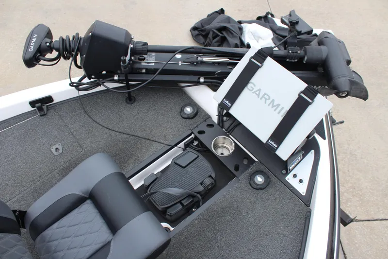 Slide: The Image of 2021 Caymas CX 18 SS boat deck with Garmin equipment and seating. - 15