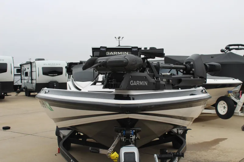 Slide: The Image of 2021 Caymas CX 18 SS boat with Garmin equipment, parked near RVs. - 2