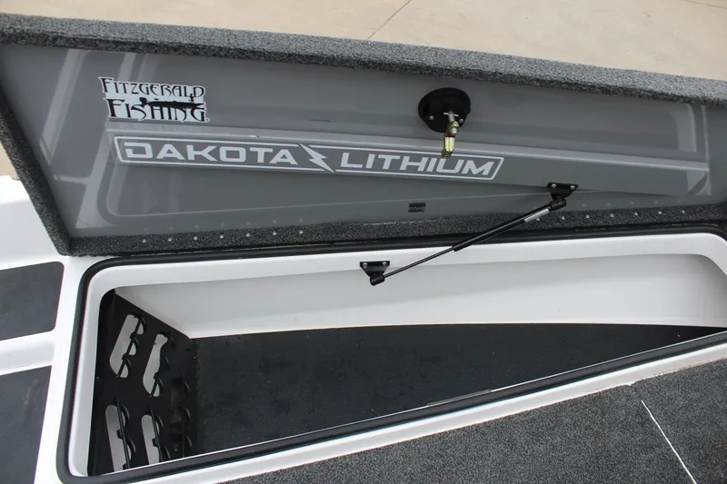 Slide: The Image of 2021 Caymas CX 18 SS storage compartment with Dakota Lithium battery branding. - 20