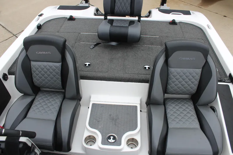 Slide: The Image of 2021 Caymas CX 18 SS boat interior with gray seating and storage compartments. - 24