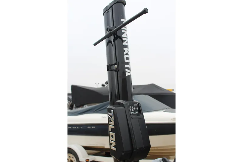 Slide: The Image of Minn Kota Talon anchor on 2021 Caymas CX 18 SS boat, with covered vessel in background. - 25