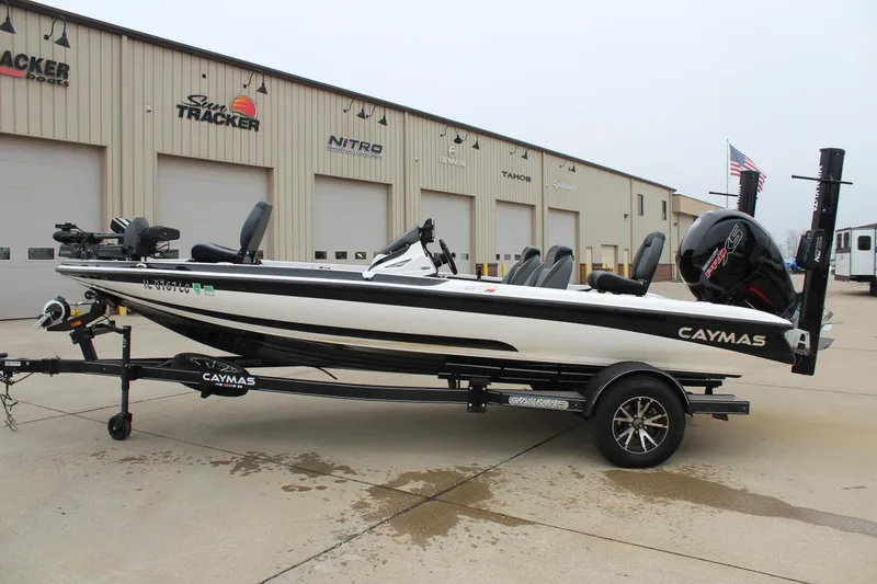Slide: The Image of 2021 Caymas CX 18 SS boat on trailer, parked outside dealership. - 4