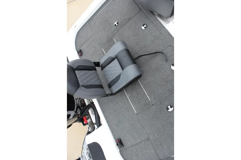 Slide: The Image of 2021 Caymas CX 18 SS boat interior with gray seating and carpeted flooring. - 9