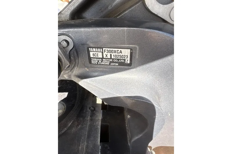 Slide: The Image of 2016 Crevalle 26 Bay boat dashboard with steering wheel and navigation equipment. - 11