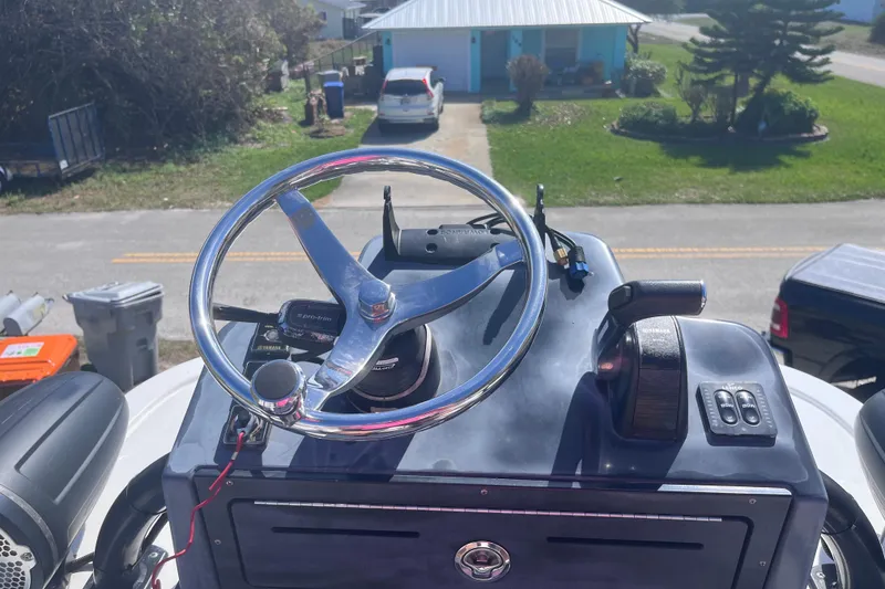 Slide: The Image of Helm of 2016 Crevalle 26 Bay boat with steering wheel and controls. - 23