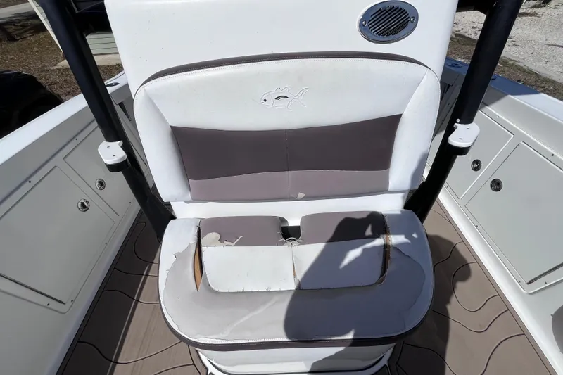 Slide: The Image of 2016 Crevalle 26 Bay boat seat with visible wear and tear. - 29
