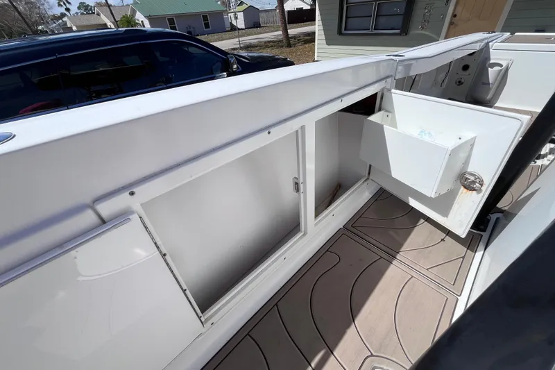 Slide: The Image of 2016 Crevalle 26 Bay boat interior with open storage compartment. - 33