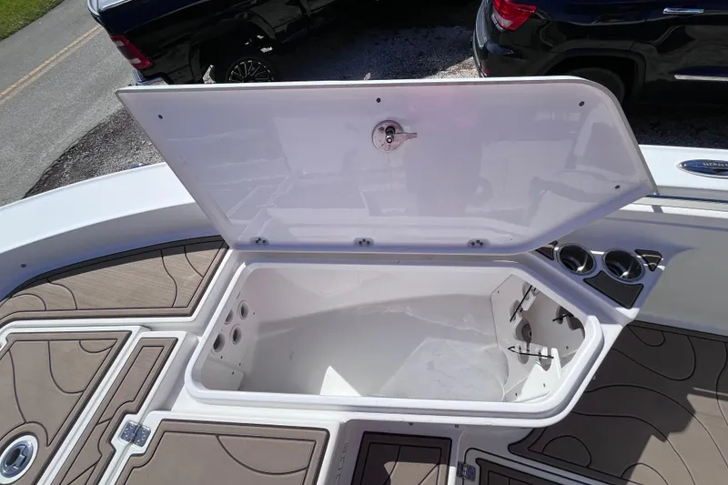 Slide: The Image of Open storage compartment on 2016 Crevalle 26 Bay boat deck. - 36