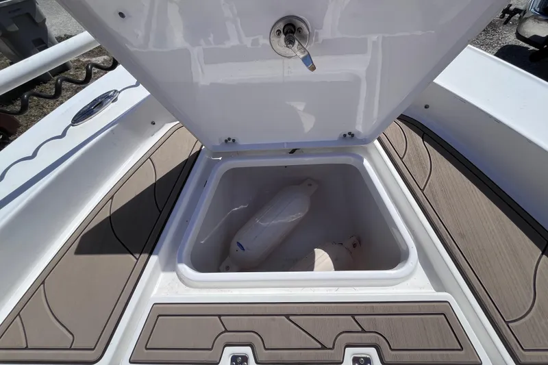 Slide: The Image of Crevalle 26 Bay 2016 storage compartment with fender. - 38