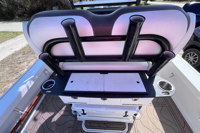 Slide: The Image of 2016 Crevalle 26 Bay boat interior with rod holders and cutting board. - 39