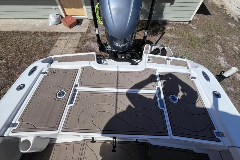 Slide: The Image of Rear view of a 2016 Crevalle 26 Bay boat with engine. - 42