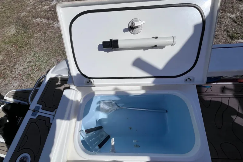 Slide: The Image of Open storage compartment on a 2016 Crevalle 26 Bay boat. - 45