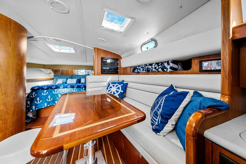 Slide: The Image of Luxurious interior of 2002 Pursuit 3800 Express yacht with nautical-themed decor. - 40