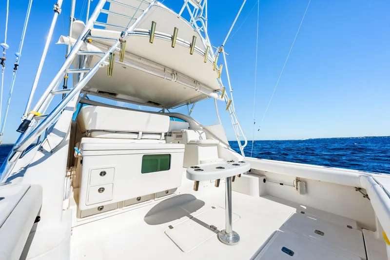 Slide: The Image of 2002 Pursuit 3800 Express yacht deck with ocean view and clear blue sky. - 7