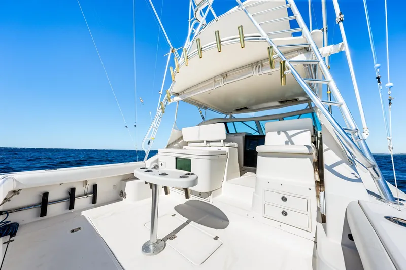 Slide: The Image of 2002 Pursuit 3800 Express yacht deck with seating and ocean view. - 8