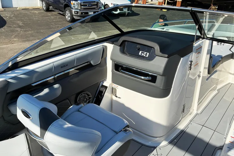 Slide: The Image of 2025 Chaparral 267 SSX boat interior with sleek seating and modern dashboard design. - 10