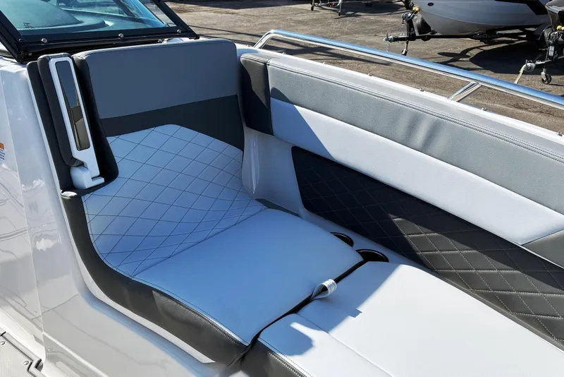 Slide: The Image of 2025 Chaparral 267 SSX boat interior with stylish, cushioned seating and modern design. - 19