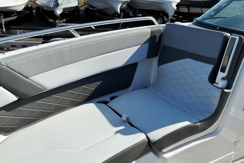 Slide: The Image of 2025 Chaparral 267 SSX boat interior with stylish gray and white seating. - 20