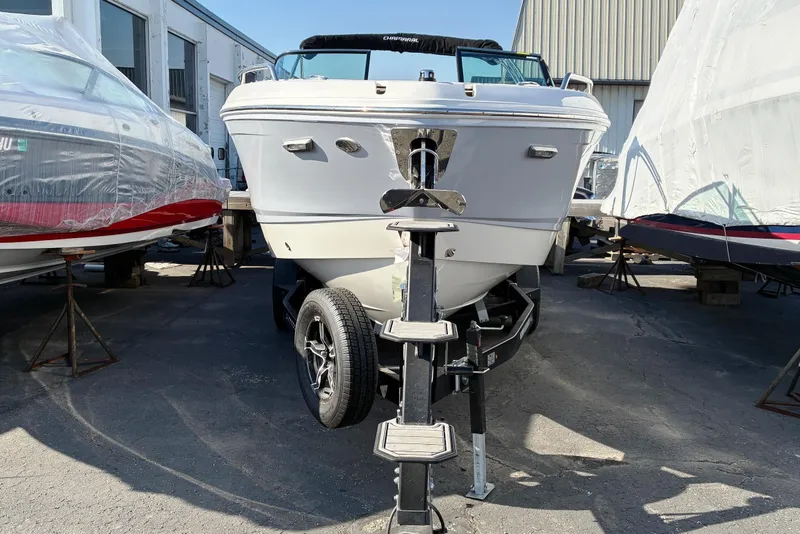 Slide: The Image of 2025 Chaparral 267 SSX boat on trailer in storage facility. - 3