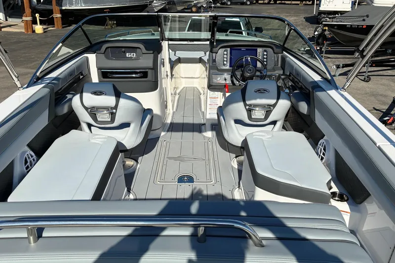 Slide: The Image of 2025 Chaparral 267 SSX boat interior with modern seating and dashboard. - 7
