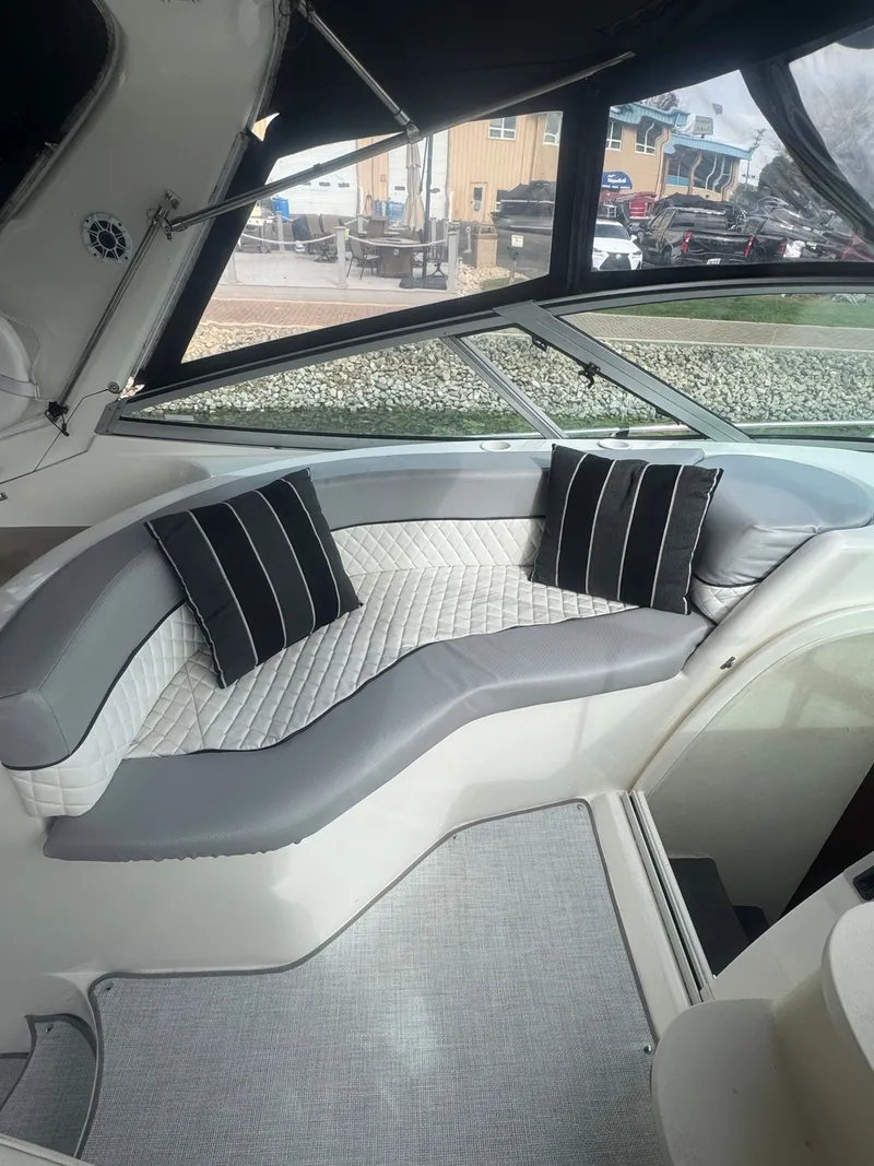 Slide: The Image of Interior of a 1998 Cruisers Yachts 3870 Espirit with cushioned seating. - 12