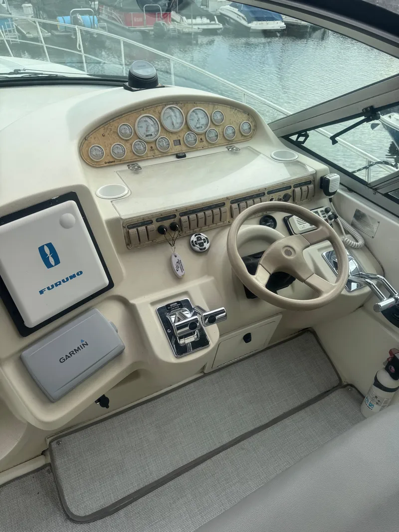 Slide: The Image of 1998 Cruisers Yachts 3870 Espirit helm with instruments and steering wheel. - 16