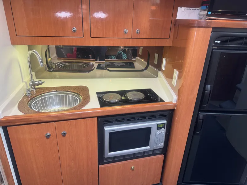 Slide: The Image of Kitchen area in a 1998 Cruisers Yachts 3870 Espirit. - 17