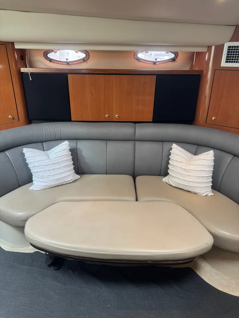 Slide: The Image of Interior of 1998 Cruisers Yachts 3870 Espirit with gray sofa and pillows. - 27