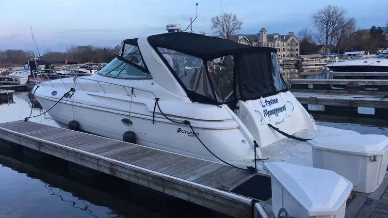 Slide: The Image of 1998 Cruisers Yachts 3870 Espirit docked at marina. - 3