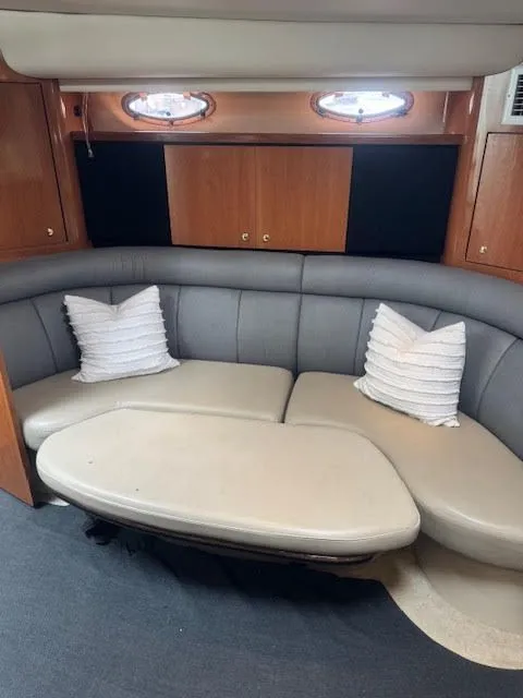 Slide: The Image of Interior of 1998 Cruisers Yachts 3870 Espirit with gray sofa and pillows. - 31