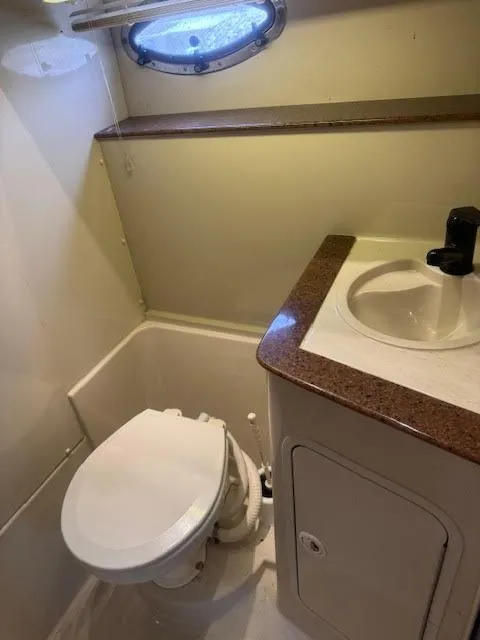 Slide: The Image of 1998 Cruisers Yachts 3870 Espirit bathroom with toilet and sink. - 34